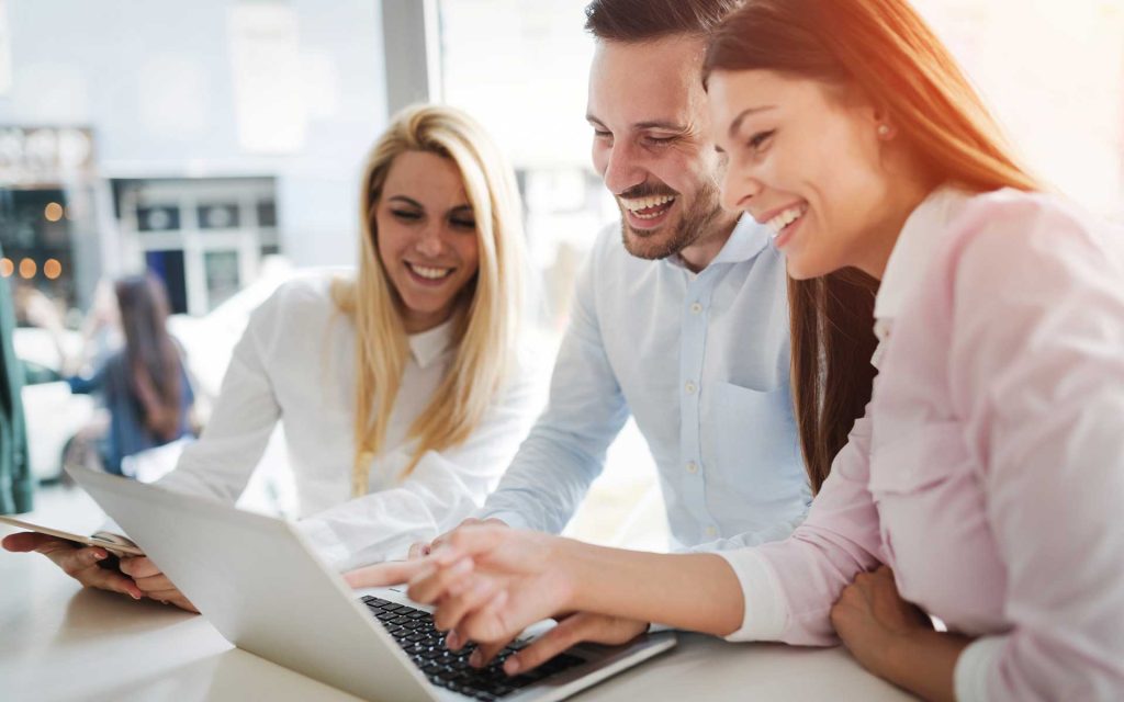 Office team looking at computer